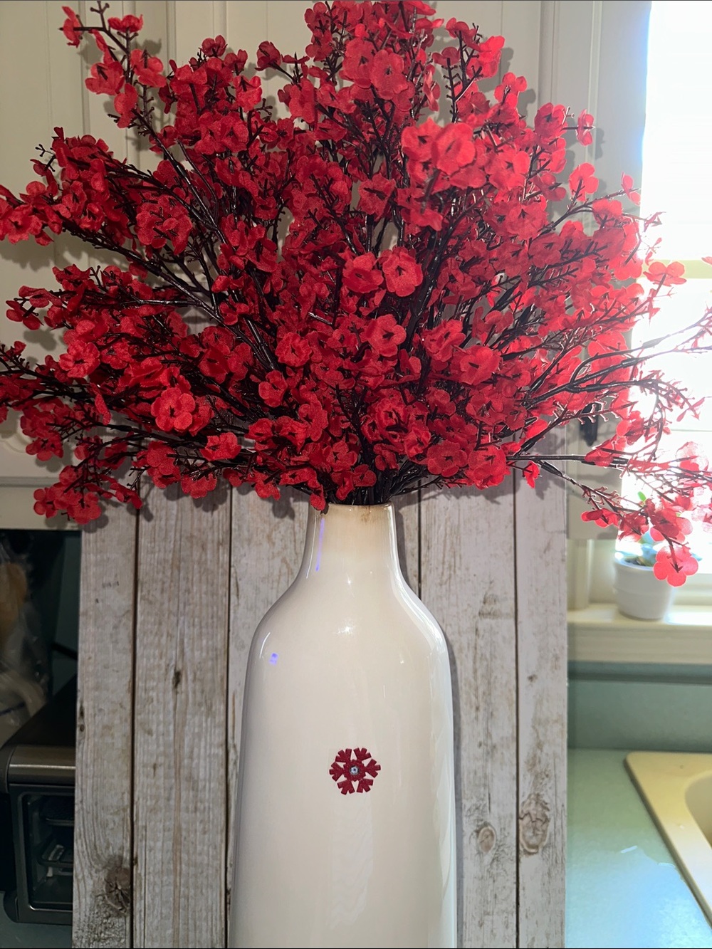 Red Floral Cherry Blossoms in White Decorative Vase